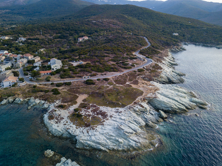 Aerial view of winding roads of the French coast. Barcaggio. Cap Corse Peninsula, the northernmost point of Cap Corse, in front of the island of Giraglia. Corsica. Coastline. franceの写真素材