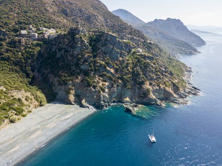 Aerial view of Nonza and tower on a cliff overlooking the sea, black beach and sea. Cap Corse Peninsula, Corsica. Coastline. franceの写真素材