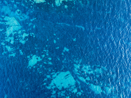 Aerial view of rocks on the sea. Coast of Corsica, cliff and panoramic views of the seabed seen from above, transparent water. Cap Corse Peninsula. franceの写真素材