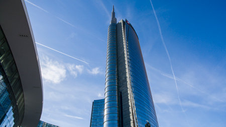 Unicredit tower seen from Gae Aulenti square, people walking. Italy's tallest skyscraper buildingのeditorial素材