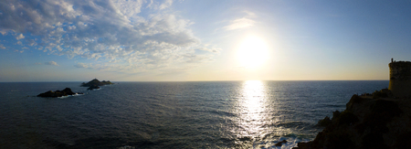 Aerial view of the Bloods Islands and the Parata Tower, the Genoese tower built in 1608, Corsica. France. Sunset over the sea on the dark red porphyry islandsの写真素材