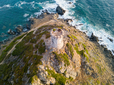 Aerial view of the Parata Tower from the sea, Genoese tower built in 1608, Corsica. France. Sunset over the sea in the Gulf of Ajaccio near the bloody islandsの写真素材