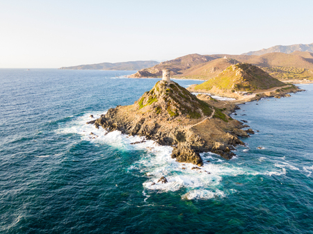 Aerial view of the Parata Tower from the sea, Genoese tower built in 1608, Corsica. France. Sunset over the sea in the Gulf of Ajaccio near the bloody islandsの写真素材