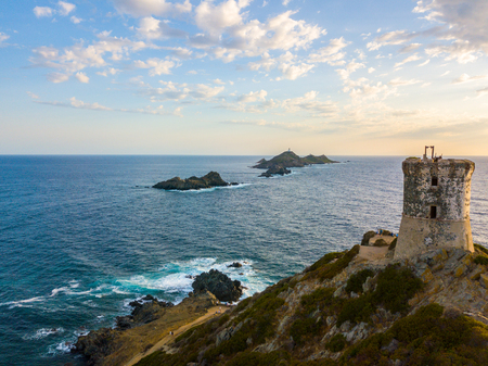 Aerial view of the Bloods Islands and the Parata Tower, the Genoese tower built in 1608, Corsica. France. Sunset over the sea on the dark red porphyry islandsの写真素材