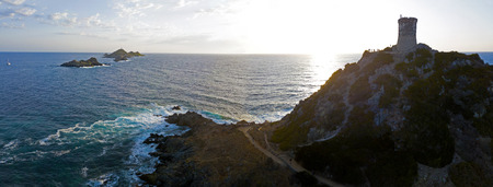 Aerial view of the Bloods Islands and the Parata Tower, the Genoese tower built in 1608, Corsica. France. Sunset over the sea on the dark red porphyry islandsの写真素材