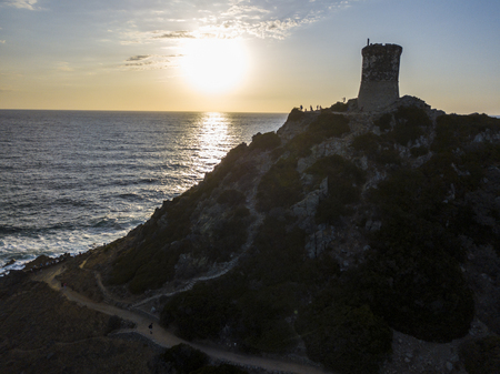Aerial view of the Parata Tower from the sea, Genoese tower built in 1608, Corsica. France. Sunset over the sea in the Gulf of Ajaccio near the bloody islandsの写真素材