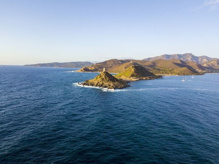 Aerial view of the Parata Tower from the sea, Genoese tower built in 1608, Corsica. France. Sunset over the sea in the Gulf of Ajaccio near the bloody islandsの写真素材