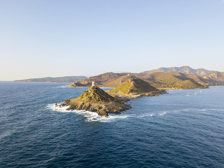 Aerial view of the Parata Tower from the sea, Genoese tower built in 1608, Corsica. France. Sunset over the sea in the Gulf of Ajaccio near the bloody islandsの写真素材