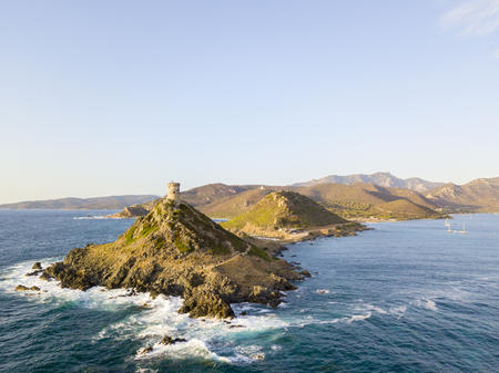 Aerial view of the Parata Tower from the sea, Genoese tower built in 1608, Corsica. France. Sunset over the sea in the Gulf of Ajaccio near the bloody islandsの写真素材
