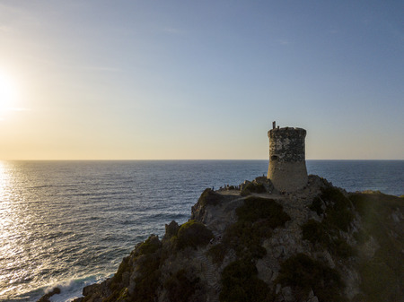 Aerial view of the Parata Tower from the sea, Genoese tower built in 1608, Corsica. France. Sunset over the sea in the Gulf of Ajaccio near the bloody islandsの写真素材