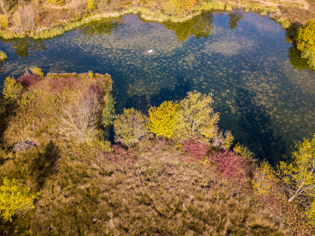 Nature and landscape: aerial view of a forest and lakes, autumn leaves, foliage, greenery and trees in a wilderness landscapeの写真素材