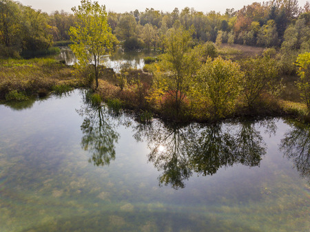 Nature and landscape: aerial view of a forest and lakes, autumn leaves, foliage, greenery and trees in a wilderness landscapeの写真素材