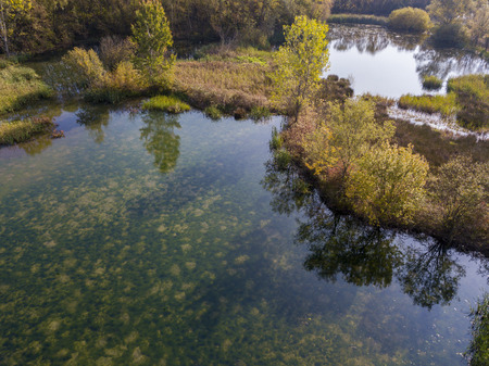 Nature and landscape: aerial view of a forest and lakes, autumn leaves, foliage, greenery and trees in a wilderness landscapeの写真素材
