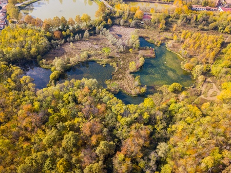 Nature and landscape: aerial view of a forest and lakes, autumn leaves, foliage, greenery and trees in a wilderness landscapeの写真素材