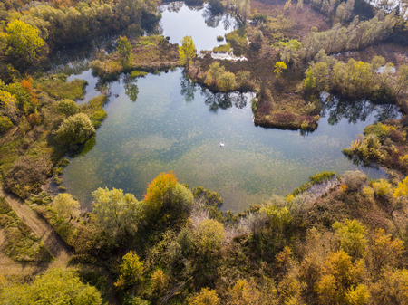 Nature and landscape: aerial view of a forest and lakes, autumn leaves, foliage, greenery and trees in a wilderness landscapeの写真素材