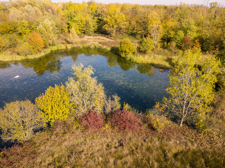 Nature and landscape: aerial view of a forest and lakes, autumn leaves, foliage, greenery and trees in a wilderness landscapeの写真素材