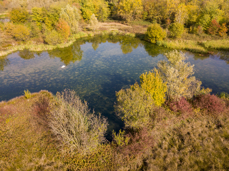 Nature and landscape: aerial view of a forest and lakes, autumn leaves, foliage, greenery and trees in a wilderness landscapeの写真素材