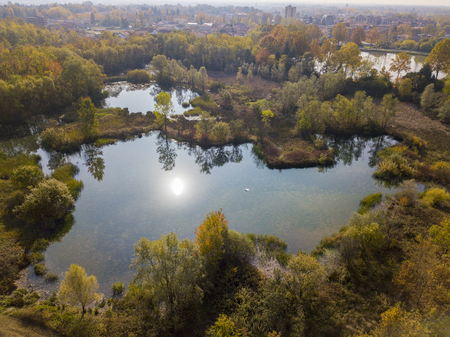Nature and landscape: aerial view of a forest and lakes, autumn leaves, foliage, greenery and trees in a wilderness landscapeの写真素材