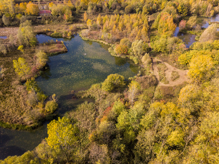 Nature and landscape: aerial view of a forest and lakes, autumn leaves, foliage, greenery and trees in a wilderness landscapeの写真素材