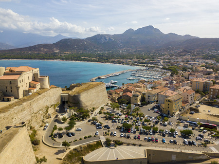 Aerial view of Calvi city, Corsica, France. Walls of the city, cliff overlooking the seaの写真素材