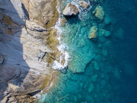 Aerial view of the rocks on the sea. Overview of the seabed seen from above, transparent waterの写真素材
