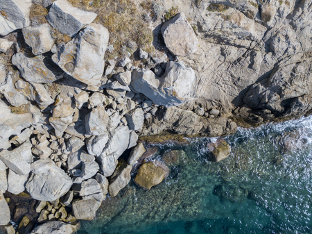 Aerial view of the rocks on the sea. Overview of the seabed seen from above, transparent waterの写真素材