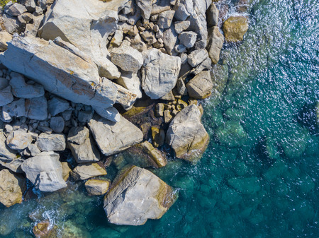 Aerial view of the rocks on the sea. Overview of the seabed seen from above, transparent waterの写真素材