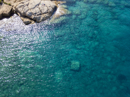 Aerial view of the rocks on the sea. Overview of the seabed seen from above, transparent waterの写真素材