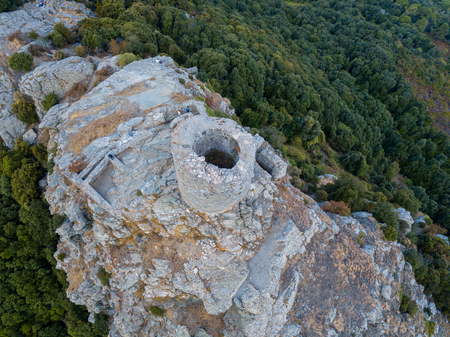 Aerial view of the Seneca Tower, Corsica, France, ancient Genoese tower of the 16th century in the heart of the Cape Corse, built as guard tower, historical monument since 1840の写真素材
