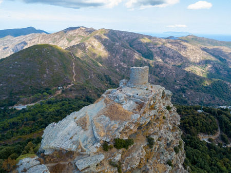 Aerial view of the Seneca Tower, Corsica, France, ancient Genoese tower of the 16th century in the heart of the Cape Corse, built as guard tower, historical monument since 1840の写真素材