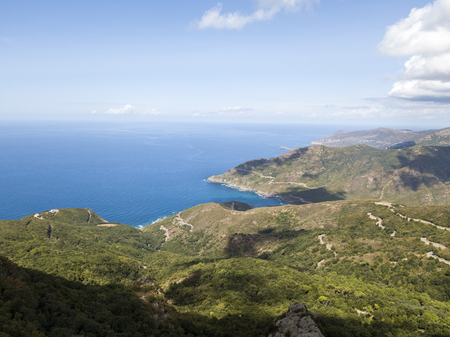 Aerial view of the coast of Corsica, winding roads and coves with crystalline sea. Cap Corse Peninsula, Corsica. Coastline. Anse d'Aliso. Gulf of Aliso. franceの写真素材