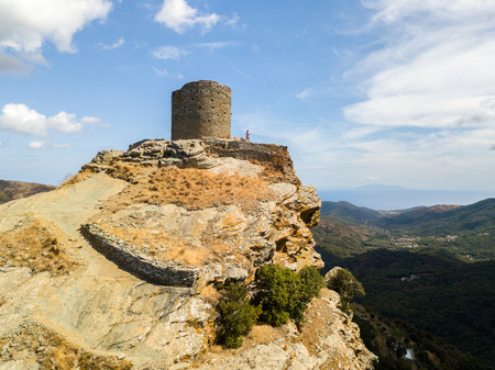 Aerial view of the Seneca Tower, Corsica, France, ancient Genoese tower of the 16th century in the heart of the Cape Corse, built as guard tower, historical monument since 1840の写真素材