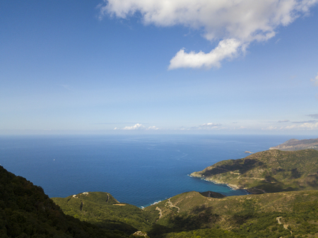Aerial view of the coast of Corsica, winding roads and coves with crystalline sea. Cap Corse Peninsula, Corsica. Coastline. Anse d'Aliso. Gulf of Aliso. franceの写真素材
