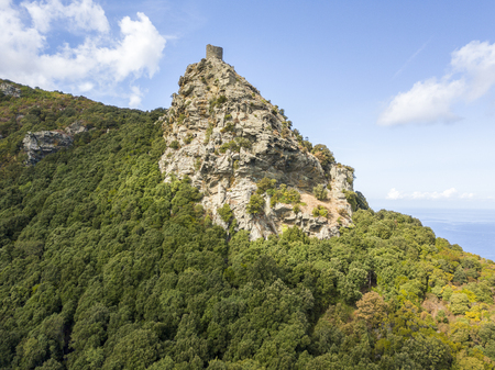 Aerial view of the Seneca Tower, Corsica, France, ancient Genoese tower of the 16th century in the heart of the Cape Corse, built as guard tower, historical monument since 1840の写真素材
