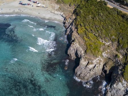 Aerial view of the coast of Corsica, winding roads and coves with crystalline sea. Cap Corse Peninsula, Corsica. Coastline. Anse d'Aliso. Gulf of Aliso. franceの写真素材