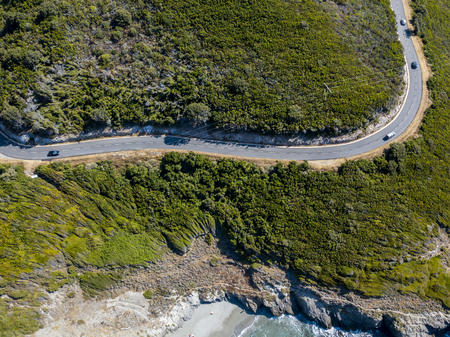 Aerial view of the coast of Corsica, winding roads and coves with crystalline sea. Cap Corse Peninsula, Corsica. Coastline. Anse d'Aliso. Gulf of Aliso. franceの写真素材
