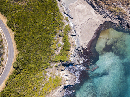 Aerial view of Corsica, winding roads and coves with crystalline sea. Cap Corse Peninsula, Corsica. Coastline. Anse d'Aliso. Gulf of Aliso. franceの写真素材