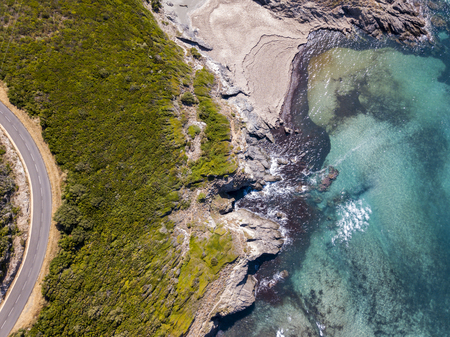 Aerial view of the coast of Corsica, winding roads and coves with crystalline sea. Cap Corse Peninsula, Corsica. Coastline. Anse d'Aliso. Gulf of Aliso. franceの写真素材