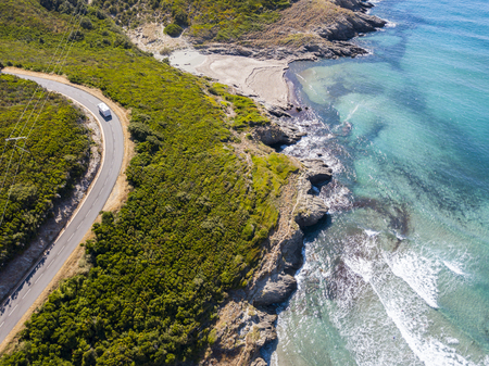 Aerial view of the coast of Corsica, winding roads and coves with crystalline sea. Cap Corse Peninsula, Corsica. Coastline. Anse d'Aliso. Gulf of Aliso. franceの写真素材
