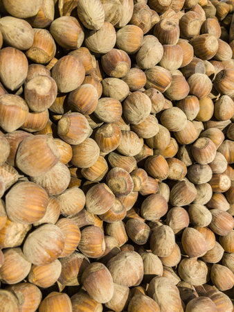 Hazelnuts, set of hazelnuts in retail. Metal scoop to collect hazelnutsの写真素材
