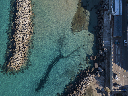 Aerial view of the pier and the sea. Houses and streets of Pizzo Calabro. Calabrian coast of Southern Italy. Calabria, Italyの写真素材