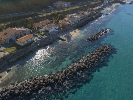 House with rocks on the sea. Pier of Pizzo Calabro, panoramic view from above. Calabrian coast of Southern Italy. Calabria, Italyの写真素材