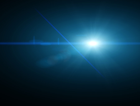 Light, bright sunbeam in space. Star glow. Blue light in a dark backgroundの写真素材