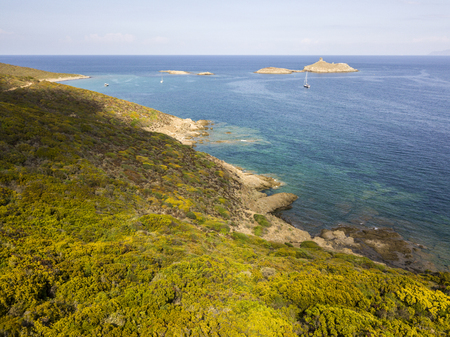 Aerial view of the islands of Finocchiarola, Mezzana, Land, Peninsula of Cap Corse, Corsica. Tyrrhenian Sea, Uninhabited Islands that are part of the municipality of Rogliano. France. Sailboats and boats moored in a bay on the Peninsula of Cap Corseの写真素材