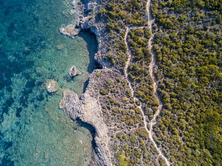 Aerial view of the Mediterranean, Corsica, France. Sea and vegetation seen from above, rocks and...