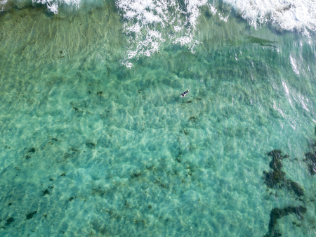 Aerial view of a crystal clear sea with waves and surfers. Playa De La Canteria. Atlantic Ocean,...