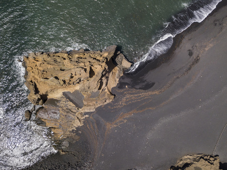 Aerial view of waves crashing on a rock formation. Playa El Golfo. Black beach of the Charco de los Clicos. Lanzarote, Canary Islands, Spainの写真素材