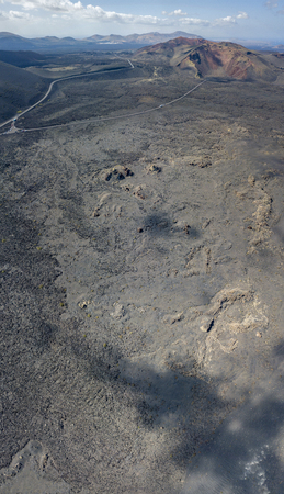 Aerial view of Timanfaya, national park, panoramic view of volcanoes, mountains, vineyards, terrain, wild nature, Lanzarote, Canary Islands, Spainの写真素材