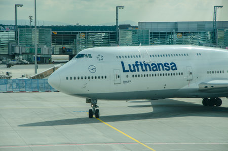 Lufthansa Boeing 747-8 aircraft in an airport terminal, maneuvering inside the hub. 09/14/2014 Milan, Malpensa. italyのeditorial素材