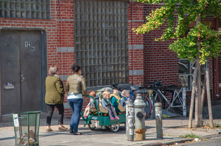 Children in the stroller, infants strolling through the streets of Brooklyn. 09/19/2014. New York Cityのeditorial素材
